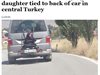 Баща завърза дъщеря си за багажника на автомобил за наказание (Видео)