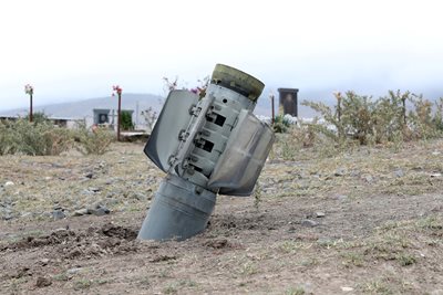 The remains of a rocket can be seen in the field of the troubled region.  PHOTO: Reuters