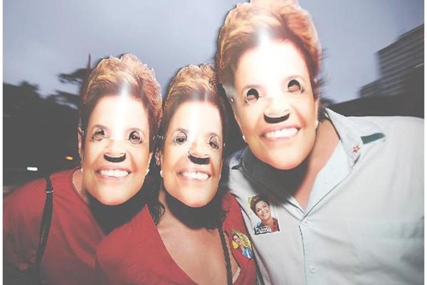 Симпатизанти на Трудовата партия шестват из Сао Паулу с маски с лика на Дилма.