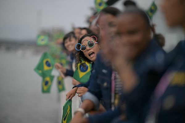 Athletes from the Brazilian delegation wave Brazilian flags Photo: Reuters