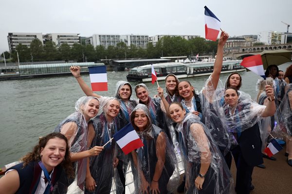 Athletes from the French delegation pose on a boat Photo: Reuters