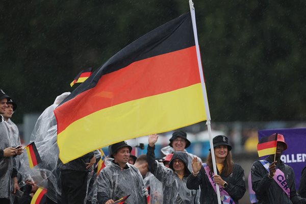 Flag bearer Anna-Maria Wagner of Germany waves her flag Photo: Reuters