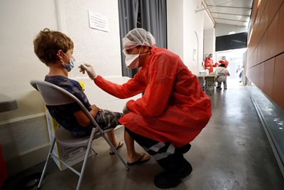 They take a sample from a child in France.  PHOTO: Reuters