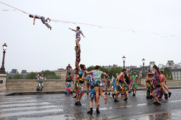 Nathan Paulin climbs a high rope to perform a performance Picture: Reuters