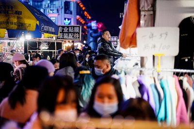 Wearing masks in Wuhan is not mandatory, but most people do it in public.  Reuters photos