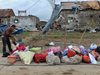 Жертвите на урагана в Китай станаха 99 души
