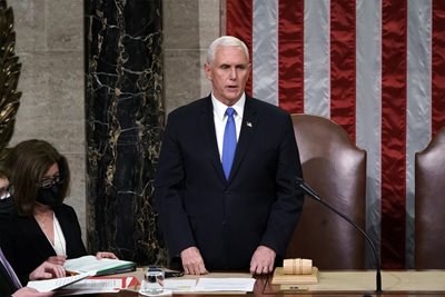 Mike Pence reads the final approval of the Electoral College ballot.  PHOTO: Reuters